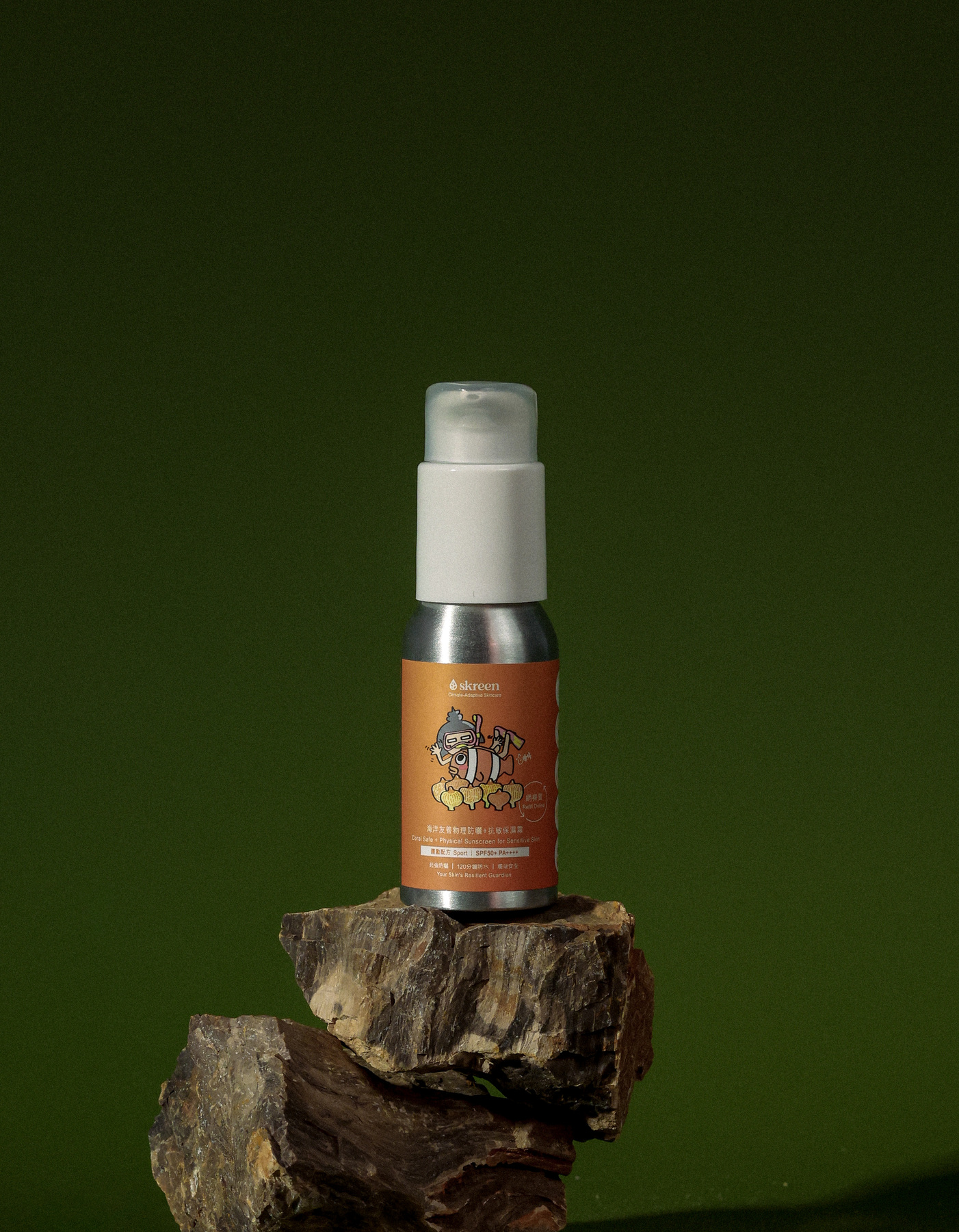 Skreen Climate Harmony Coral Safe Sport Physical Sunscreen SPF50+ PA++++ bottle on a natural wooden surface with green leaves and ocean waves in the background, eco-friendly waterproof mineral sunscreen for sensitive skin, made in Hong Kong, 100% reef-safe, sweat-resistant for hiking and commutes in humid weather.